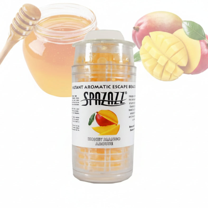 A clear plastic jar of SpazZZ Instant Aromatic Escape Beads, strawberry passion fruit flavor, shown with a honey dipper and fresh mangoes and strawberries in the background to indicate flavor.